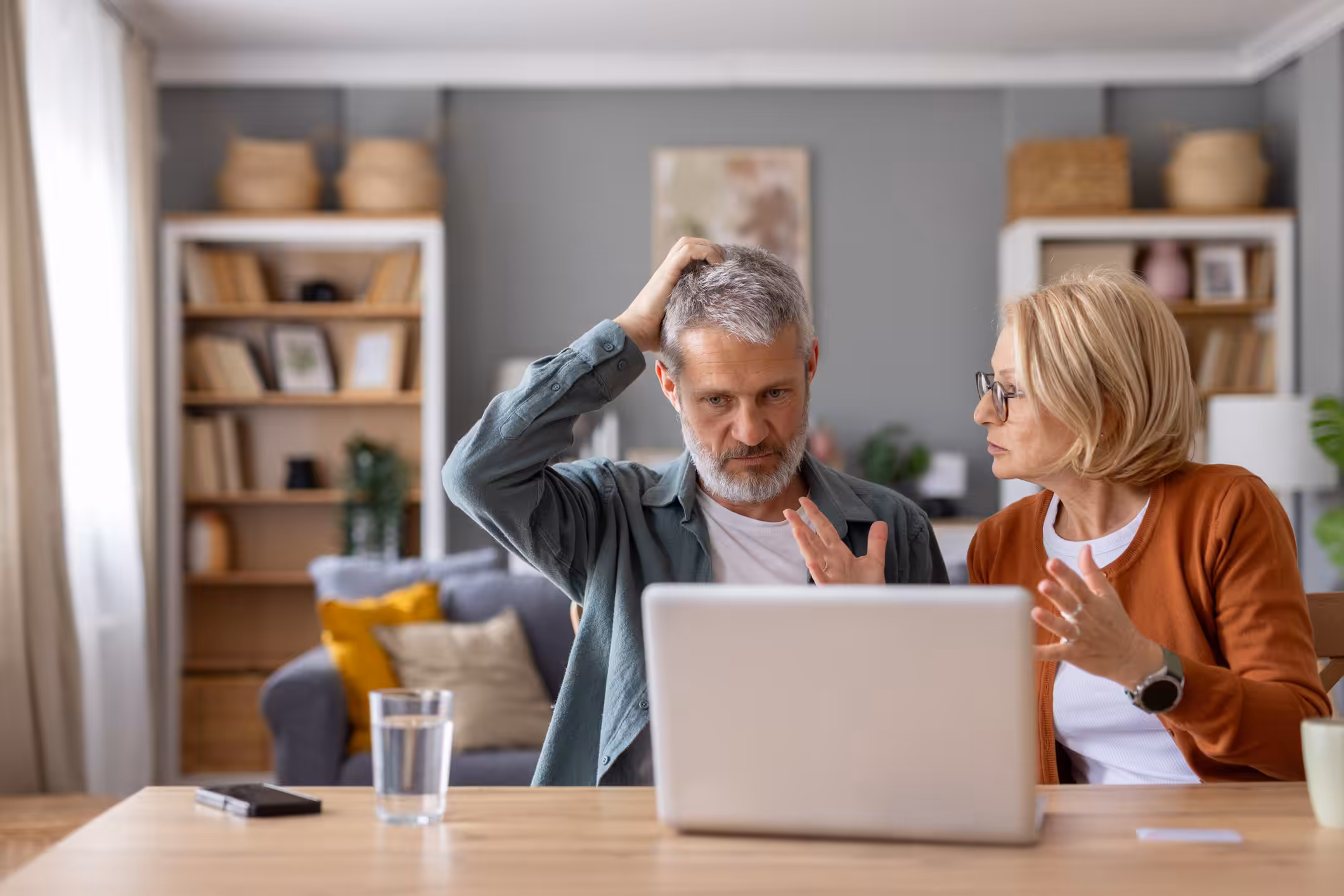 A couple navigates technology challenges together at home